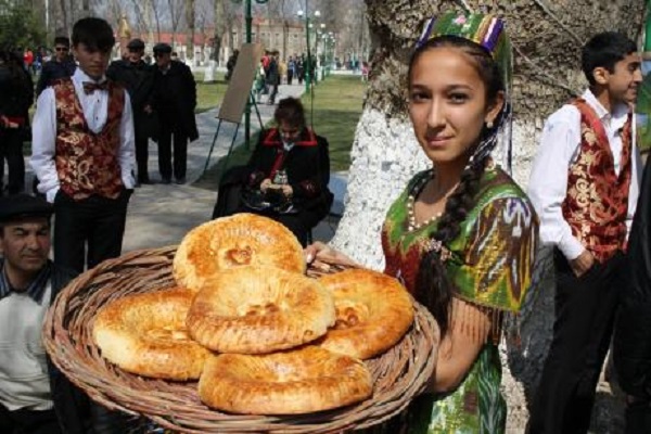 girl selling special samarkand bread - Uzbekistan Senior Citizen Tour